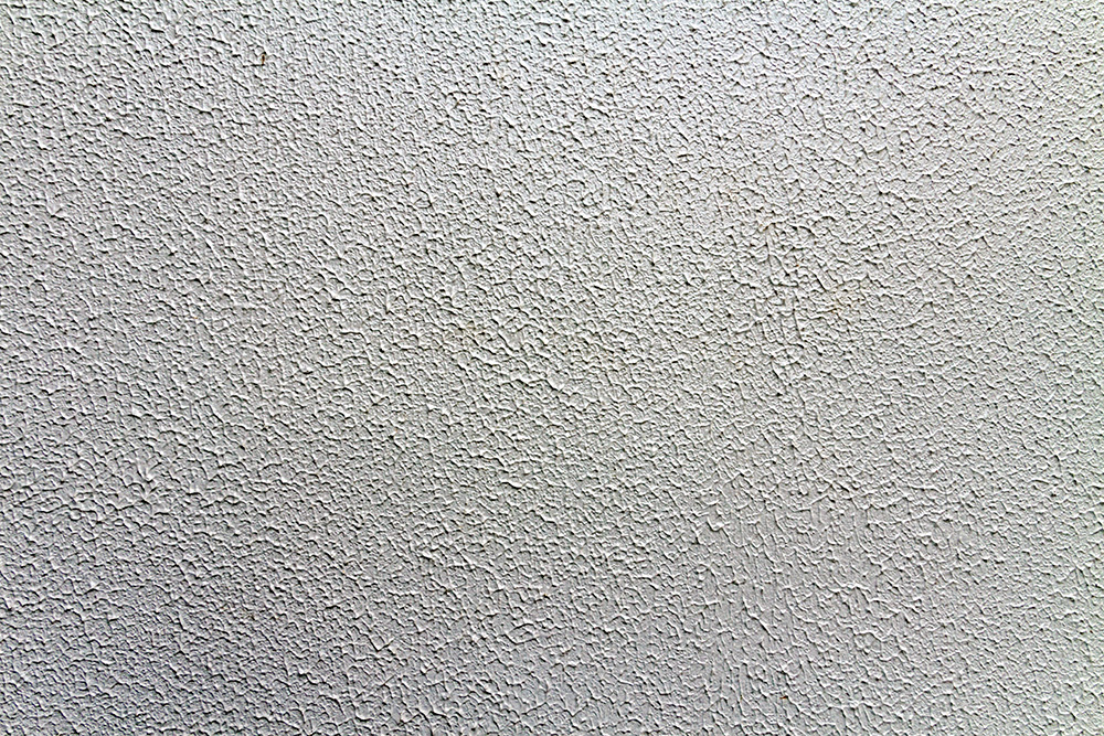 closeup of a popcorn ceiling - removing popcorn ceilings concept